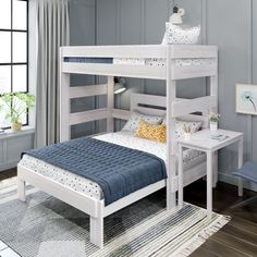 a white bunk bed sitting in a bedroom next to a window