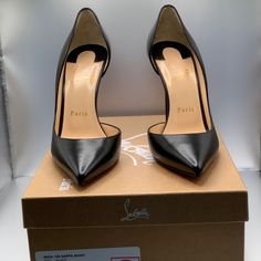 Elevate Your Style With These Timeless Louboutin Iriza 100 Heels In Black Leather. These Shoes Have Never Been Worn And Come With The Original Box And Shoe Bag. They Come In Size 37 And Feature A Sleek Black Leather Upper With A Pointed Toe And A 4 Inch Stiletto Heel. The Signature Louboutin Red Sole Adds A Pop Of Color And A Touch Of Luxury To This Classic Design. The Padded Leather Insole Provides Comfort And Support For All-Day Wear. The Sophisticated And Elegant Style Of These Shoes Makes Th Elegant Red Sole Heels For Office, Formal Open Heel Court Shoes With Branded Heel Counter, Luxury Closed Toe Heels For Office, Designer Business Heels With Sculpted Heel, Luxury Court Shoes With Branded Heel Counter, Designer High Heel Court Shoes For Business, Designer High Heel Court Shoes With Sculpted Heel, Designer Ankle Strap Heels For Business, Designer Heels With Padded Heel For Formal Occasions