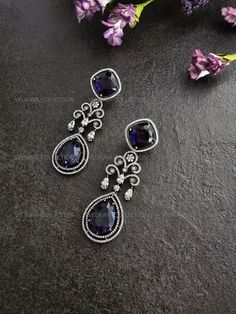 Stunning Unique Victorian earrings with beautiful purple CZ stones and rhodium plating. Made with highest quality CZ stones and expert craftsmanship. Length - 3 inch Width - 1 inch Weight - 15 gm each ----------- CARE ----------- - Store in air tight zip lock bags - Do not expose to moisture/water - Do not spray chemicals or perfumes on the jewelry Please feel free to contact us if you have any questions. * We sell high quality imitation jewelry only. All measurements are approximate. Please note that all sales are final. Thank you American Diamond Earrings, Victorian Earrings, Earrings Indian, Indian Earrings, Jewelry Indian, Earrings Crystal, Jhumka Earrings, Jewelry Manufacturers, American Diamond