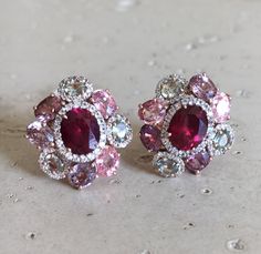 A Statement Earring handcrafted in Rose Gold Plated over Sterling Silver features a center Garnet embellished with Multi-color Spinel and Tourmaline and Halo Diamonds. A stunning, jaw-dropping stud earrings that makes a commanding statement earrings.(e-c-63) Earring measure 9mm x 20mm *LIKE* us on Facebook http://www.facebook.com/Belesas to get 10%off coupon code, *FOLLOW* us on Twitter https://twitter.com/#!/Belesas to get more exclusive coupon codes *All item are ready to ship! Free shipping o Luxury Pink Multi-stone Earrings, Elegant Red Multi-stone Earrings, Multicolor Gemstone Accented Earrings For Formal Occasions, Pink Multi-stone Earrings Fine Jewelry, Pink Multi-stone Earrings In Fine Jewelry Style, Pink Gemstones In Fine Jewelry Style, Pink Multi-stone Earrings For Anniversary, Luxury Pink Gemstone Earrings, Multicolor Gemstone Accented Fine Jewelry Earrings