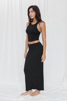 Elegant, feminine and oh so comfy. The long rib skirt fit close to the body whilst being super stretchy and easy to move in. This is loungewear elevated - the ultimate staple for every soft girl. Made from LENZING™ ECOVERO™ ribbed fibers. Body contouring and organic fabric that feels like a second skin Buttery soft and stretchy Hugs your curves at the right places for a sleek look Side seam Length: Size S 93.5cm/37" -Naya is 175cm/68" and is wearing size M. Caitlin is 172cm/67" and is wearing si Spring Ribbed Stretch Maxi Skirt, Casual Stretch Maxi Skirt For Loungewear, Spring Stretch Ribbed Maxi Skirt, Relaxed Solid Skirt For Loungewear, Chic Seamless Loungewear Bottoms, Casual Maxi Skirt For Loungewear, Chic Ribbed Skirt For Loungewear, Spring Ribbed Skirt For Loungewear, Solid Stretch Skirt For Loungewear