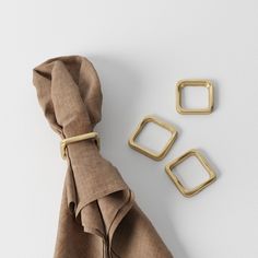 two napkin rings and one piece of cloth