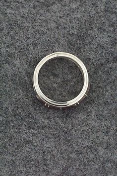 This onyx and sterling silver inlay ring was made by Navajo silversmith Wilbert Muskett Jr. The inside of the band is signed M and stamped sterling.Size: 7Length: 1/4"Free shipping on all orders! We ship with USPS and always include tracking. All orders ship within a day of payment.Returns are accepted up to 30 days after you receive your order. Just send us a message. Our shop offers cash back or store credit. The item must be returned in new condition. Modern Silver Ring With Inlay, Modern Silver Rings With Inlay, Modern Anniversary Rings With Inlay, Sterling Silver Inlay Ring For Anniversary, Formal Sterling Silver Rings With Inlay, Silver Sterling Stackable Rings Channel Set, Silver Stackable Channel Set Sterling Silver Rings, Bear Carving, Pearl Chain