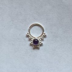 These are soooooo pretty. Made is 925 sterling silver with tribal details, set with a bright amethyst  stone. The rings are all 1cm (.40”) in diameter. The wire is 20 gauge.Stones shine light through them since the back is open. Hard to see this when they are lying flat in the pic. Each piece is made BY HANDOne of the images contains numbers to specify which you would like from the drop down menu. Spiritual Silver Amethyst Ring In Sterling Silver, Sterling Silver Body Jewelry, Bohemian Amethyst Crystal Ring In Silver, Spiritual Silver Amethyst Ring, Spiritual Stamped 925 Amethyst Ring, Nickel Free Sterling Silver Belly Rings, Nickel-free Sterling Silver Septum Ring, Nickel-free Sterling Silver Belly Rings, Handmade Sterling Silver Septum Ring