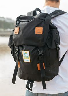 If you're going a little further afield or you just don't like packing too light then this is the rucksack for you! Large Explorer Rucksack in Black finished with our New Wave logo patch. Traveller size fully functional bag perfect for any occasion. This is Carrie's go-to for festival's abroad! You can pack enough for a full week away with plenty of outfit changes (tried & tested!) AND it's the perfect size for cabin luggage so makes for a quicker journey (no waiting for the carousel after a lon Large Capacity Nylon Backpack For Trip, Large Capacity Backpack For Hiking, Functional Large Capacity Backpack For Hiking, Black Bags With Functional Pockets For Overnight Trips, Nylon Standard Backpack For Adventure, Functional Backpack With Luggage Sleeve For Outdoor Activities, Black Waterproof Backpack For Outdoor, Durable Black Travel Backpack, Practical Black Travel Accessories For Outdoor Activities