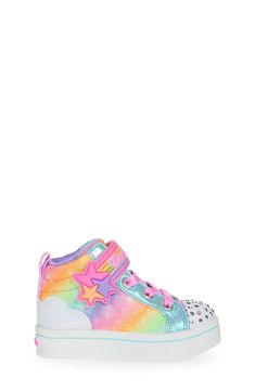 Inspired by a rainbow-filled sky, this glittery sneaker is packed with glitz and finished with a light-up rhinestone cap toe. Adjustable hook-and-loop closure with elastic laces Synthetic and textile upper/textile lining/synthetic sole Imported Casual Light-up Sneakers With Round Toe, Casual Multicolor Glitter Sneakers, Skechers Kids, High Top Sneaker, Elastic Laces, High Top, Light Up, High Top Sneakers, Nordstrom