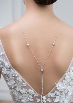 Bridal backdrop necklace made of a very fine sterling silver chain with rhinestone crystal balls and a cubic zirconia round stone in setting. This is an over the head necklace without clasp. Can easily be worn as a sautoir after the wedding. To be worn with matching Josephine bracelet and earrings. - Length: It falls in the back at about 28cm from the base of the neck - 925 Sterling Silver chain Made in France - 7 day return or exchange Made to order: Any length possible, No extra cost. Returns accepted ! Please convo. ♥ Josephine collection https://www.etsy.com/fr/shop/Princessed1jour?ref=l2-shopheader-name&search_query=josephine ♥ All bridal backdrop necklaces https://www.etsy.com/fr/shop/Princessed1jour?ref=seller-platform-mcnav&section_id=22993082 ♥ My shop https://www.etsy.com/fr/shop Dainty Silver Clavicle Body Chain, Dazzling Wedding Necklace With Delicate Chain, Dazzling Delicate Chain Necklace For Wedding, Elegant Silver Delicate Body Chain, Elegant Crystal Lariat Necklace With Clavicle Chain, Elegant Crystal Lariat Necklace, Elegant Crystal Lariat Backdrop Necklace, Elegant Crystal Lariat Necklace With Dangle, Elegant Crystal Lariat Drop Necklace