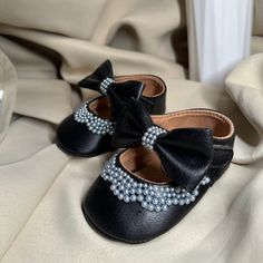 Black Personalised Christening Baptism Shoes with Crystals Baby Shower Gift OCCASION These are perfect for Christening, Baptism, newborn photo shoot, baby shower gift, wedding shoes, parties or even as a footwearwear in your baby's day to day life! DELIVERY Processing time for all orders is 2 working days The size in the image is for NEWBORN (0-6 months), however shoes can be custom made, just get in contact with us and we will discuss. Christening Shoes, Cadeau Baby Shower, Baby Wedding, Newborn Photoshoot, Shoes Baby, Newborn Photo, Gender Neutral Baby, Newborn Photos, Baby Shower Gift