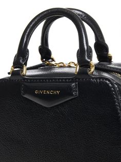 Givenchy’s Antigona Cube Nano bag in black shiny leather featuring double top handles, two-way zip fastening, detachable shoulder strap, padded pentagonal insert with embossed logo on the front, internal card slot and gold-tone metal hardware.170x130x60x1090mmSize Type: UniqueGender: WomenMaterial: FURS & SKINS->BUFFALO LEATHER100 %Color: BlackMade in: ITProduct ID: BB50ZUB24B001*Import tax/duty will be calculated at checkout (If applicable) Luxury Formal Bags With Zipper Closure, Luxury Bags With Zipper Closure For Formal Occasions, Luxury Bags With Zipper Closure For Formal Events, Luxury Shoulder Bag With Zipper Closure For Formal Occasions, Formal Bags With Top Handle And Gold-tone Logo Plaque, Formal Bags With Gold-tone Logo Plaque And Top Handle, Leather Business Bags With Gold-tone Logo Plaque, Luxury Satchel With Zipper Closure And Top Handle, High-end Formal Bag With Zipper Closure