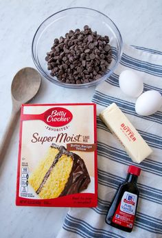 ingredients to make chocolate cake laid out on a table