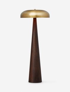 a table lamp with a wooden base and gold dome light on it's top