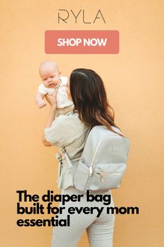 a woman holding a baby in her back pack with the words shop now on it