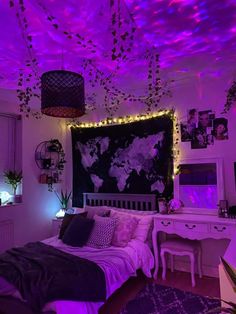 a bedroom with purple lighting and decorations on the ceiling is lit up by lights that are suspended from the ceiling