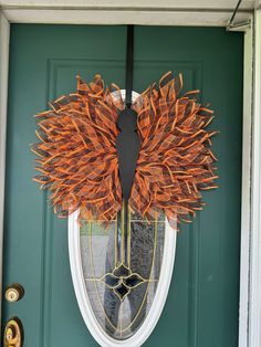 a wreath is hanging on the front door