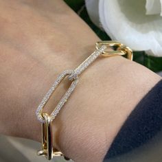 The strong links that made the chain unbreakable are the very reason chains are often used to symbolize eternal love. It's a beautiful bracelet set in 14K Yellow Gold. Fine Jewelry Diamond Bracelet With Solid Link For Gift, Diamond Bracelets With Rectangular Links For Anniversary, Timeless Link Diamond Bracelet Gift, Anniversary Diamond Bracelet With Rectangular Links, Fine Jewelry Diamond Tennis Bracelet, Fine Jewelry Diamond Tennis Bracelet With Solid Link, Diamond Link Bracelet As Gift, Diamond Link Chain Bracelet Gift, Diamond Tennis Bracelet In Fine Jewelry Style