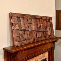 a wood paneled fireplace mantel in a living room