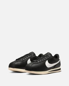 Women's Nike Cortez Premium in Black and Sail. This low-top sneaker features a leather base with leather overlays on the upper. Tonal branding is stitched on the mesh tongue with additional branding embossed on the heel. Money Tattoo, Nike Cortez, Model Measurements, Black Nikes, Low Top, Top Sneakers, Womens Sneakers, Nike Women, Sailing