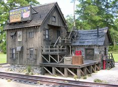 a model train station with an old wooden building