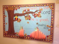 a bulletin board with an owl sitting on a tree and the words give thanks to the lord he is good