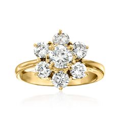 a yellow gold ring with three diamonds on the center and two rows of stones in the middle