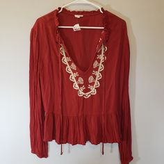 Nwt Wet Seal Boho Long Sleeve Flowy Rust Blouse With Embroidery Detail And Tie Front Size Small Festival Long Sleeve Rayon Tops, Long Sleeve Tops With Lace Trim For Festival, V-neck Lace Trim Blouse For Festival, Long Sleeve Top With Lace Trim For Festivals, Festival V-neck Tops With Lace Trim, Festival V-neck Top With Lace Trim, Red Bohemian Tops With Lace Trim, Bohemian Long Sleeve Brown Blouse, Bohemian Red Tops With Lace Trim