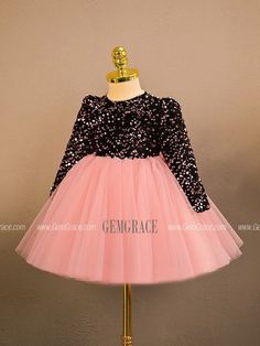 a pink and black dress with sequins on it