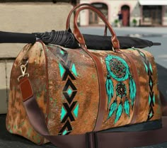 "This western cowgirl Indian dream catcher travel duffle Weekender bag is all about style. Our boho western style duffel bag is made with high-grade nylon waterproof fabric, it's a highly durable means of transferring your essentials wherever you go. With multiple compartments, a resilient carrying handle, and an adjustable shoulder strap, it's the perfect companion for all your adventures. This southwestern and turquoise tribal Indian style design will have everyone asking where did you get it Western Luggage Sets, Bohemian Rectangular Bag For Overnight Trips, Bohemian Rectangular Weekender Bag With Luggage Sleeve, Bohemian Duffle Bag For Overnight Trips, Bohemian Rectangular Duffle Bag For Weekend Trips, Bohemian Tote Travel Bag With Luggage Sleeve, Brown Bohemian Weekender Bag For Overnight Trips, Bohemian Brown Weekender Bag For Overnight Trips, Bohemian Rectangular Duffle Bag For Overnight Trips