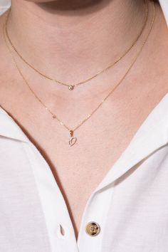 This diamond initial pendant necklace is the perfect way to show your style every day in glamour. Created in brightly polished 14k yellow gold, this beautiful diamond initial pendant can be customized with the letter of your selection. The diamond initial pendant is placed on a tapered bail with a sturdy chain threaded through, making it ready for gifting and wear.Purchase multiple initials and letters and create a unique look just for you. Sparkling diamonds adorn the front of the pendant, addi Diamond Initial Necklace, Initial Pendant Necklace, Initial Pendant, Sparkle Diamonds, Initial Necklace, Initials, Diamonds, White Gold, Yellow Gold