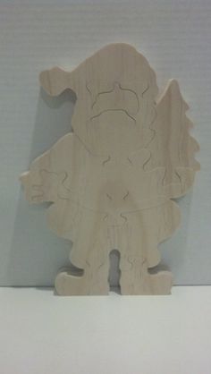 a wooden toy that is shaped like a dinosaur