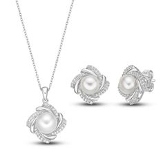 This radiant boxed set features a matching necklace and pair of earrings set in classic sterling silver. Each piece showcases a lustrous freshwater cultured pearl surrounded by a dazzling frame of white lab-created sapphires. The pendant hangs from an 18-inch cable chain and secures with a lobster clasp. Elegant Jewelry Sets With Pearl Pendant For Gift, Mother's Day Pearl White Sterling Silver Jewelry, Classic White Gold Sterling Silver Jewelry Sets, Pearl White Jewelry For Mother's Day Formal Occasions, Classic Sterling Silver Jewelry Sets In Diamond White, Classic White Gold Jewelry Set, Classic White Gold Jewelry Set For Gifts, Elegant White Gold Sterling Silver Jewelry Sets, Elegant White Gold Jewelry Sets In Sterling Silver