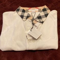 Boys White Classic Burberry Polo. Size 12y. Small Stain Bottom Left Side See Last Picture Designer White Collared Top, White Collared Preppy Shirt, White Preppy Collared Shirt, Burberry Polo Shirt, Burberry Shirts, Burberry Shirt, Boys Top, Shirts Tops, Burberry