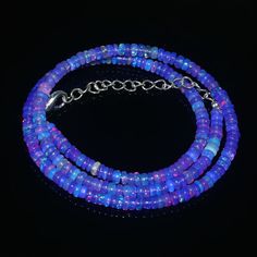 "OPAL NECKLACE'S| AAA++ Ethiopian Welo Opal|Purple Opal Beads Necklace|Opal Bead Stand| Welo Fire Opal| Multi Fire Opal Beads| Genuine Opal Gemstone Type : Opal Gemstone Item Code :   1192 Origin       -:     Ethiopia Grade       -:  AAA++ Stone shape-: Smooth Rondelle Beads Stone color-:Purple Opal Same As Picture Metal        -:     Brass Length     -: 16 Inch Quantity  -: 1 Strand Necklace Approx Weight   :  41.10 Carat Approx Size        :   4X4 MM 100% Genuine & Natural If you have any questions about this item please contact me I will get back to you as soon as If you want More Quantity in Any Necklace then you can get it in our company. ABOUT US skgemsstone based in Jaipur, India is a company engaged in supplier, manufacturing, wholesale and retail business of Gemstones ( semi preci Pink Opal Round Beads Necklace, Opal Beaded Necklaces For Jewelry Making, Opal Beaded Necklace Gift, Opal Beaded Necklace For Gift, Beaded Opal Necklace For Gift, Polished Round Bead Opal Necklaces, Polished Round Opal Bead Necklaces, Opal Necklaces With Polished Round Beads, Adjustable Opal Bead Necklaces