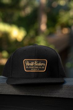 Thrill Seekers - A Good Time Company. This clean lid features our 'Billboard' patch sewn into a black 6 panel snapback hat. Details High profile, mid-deep fitting structured snapback Plastic adjustable snapback Flat Bill One Size Fits All Materials 100% Cotton Canvas Classic Snapback Fitted Hat With Logo Patch, Classic Snapback Hat With Logo Patch And Curved Bill, Classic Snapback Hat With Logo Patch, Classic Fitted Hat With Logo Patch And Flat Bill, Snapback Baseball Cap For Skateboarding, Classic Black Snapback Hat With Logo Patch, Classic Snapback Hat With Logo Patch For Streetwear, Urban Flat Brim Baseball Cap For Skateboarding, Adjustable Flat Bill Snapback Hat For Skateboarding