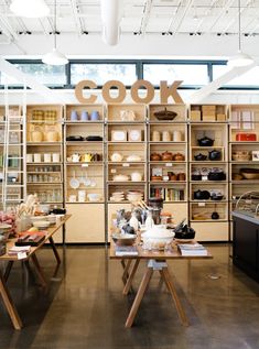 the interior of a shoe store with shelves full of shoes and other items on display