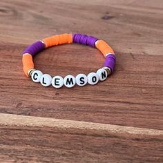 Handmade Stretch Elastic One size fits most Clemson Clay Bead Bracelets, Adjustable Purple Beaded Name Bracelet, Adjustable Orange Jewelry With Letter Beads, Inspo Bracelets, Clay Bead Bracelet Ideas, Bead Bracelet Ideas, Clay Bead Bracelets, Clay Bead Bracelet, Bracelets Patterns