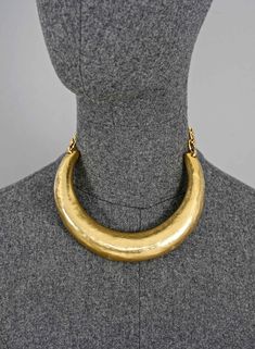 Features: - 100% Authentic YVES SAINT LAURENT. - Hammered rigid choker necklace. - Gold tone. - Adjustable hook closure. - Signed YVES SAINT LAURENT Rive Gauche Made in France. - Excellent vintage condition. Measurements: Circumference: 11.41 inches (29 cm) Chain Extender: 6.69 inches (17 cm) **This choker necklace will be shipped via Priority Shipping with tracking number. Please convo me for any queries and additional photos. Thank you for visiting. Other Fees that buyers need to know: Please Gaudy Jewelry, Ysl Jewelry, Vintage Yves Saint Laurent, Vintage Ysl, Vintage Choker, Jewelry Ads, Retro Jewelry, Gold Choker Necklace, Rive Gauche