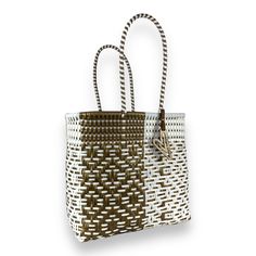 Indulge in luxury with our Duo tote, featuring the timeless Maria Victoria Bag in a captivating handwoven design. Made from repurposed plastic, this versatile bag is perfect for poolside lounging, beach outings, grocery excursions, and everyday tasks. With easy cleaning and fade-resistant colors, you'll never want to leave without it. Measurements: length x depth x height with handle length Extra Large(OT): 17.5x8x18.5 inches with 8 inch handles Large(OR): 15.5x7.5x15 with 8 inch handles Medium( Luxury Open Weave Beach Bag, White Rectangular Woven Leather Straw Bag, White Open Weave Straw Bag For Everyday Use, Luxury Rectangular Beach Bag For Vacation, White Handwoven Straw Bag For Everyday, Everyday White Handwoven Straw Bag, Eco-friendly White Open Weave Beach Bag, Eco-friendly White Open Weave Bag, Modern Handwoven Straw Bag For Everyday Use