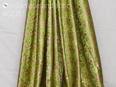 Apple Green Indian Jacquard Dress Material Brocade Wedding Dress Fabric By The Yard Crafting Sewing Silk Curtains Making Duvet Cover Bridal Dresses. Tanchoi Banarsi Brocade Fabric. This is a beautiful jacquard floral design fabric in Apple Green color. ➤ Fabric Type: Blended Silk (Viscose & Silk Satin) ➤ Color: Apple Green, Pink, Lime Green and Golden. ➤ Code: bg2261 ➤ Width of the fabric is 44 inches. ➤ Listing for 1 Yard of fabric. ➤ Care: Dry Clean Only You can use this fabric to make Dre Green Brocade Dress For Wedding, Green Brocade Wedding Dress, Fitted Green Fabric For Festive Occasion, Festive Fitted Brocade Fabric, Fitted Green Festive Fabric, Fitted Formal Brocade Fabric, Formal Fitted Brocade Fabric, Sewing Silk, Yard Diy