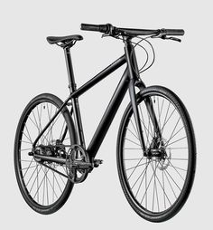 a black and white photo of a bike on a gray background with the front wheel missing