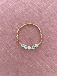 This listing is for ONE (1) bracelet. Please select the style you would like and the length. If you would like a different sorority name/letters I can definitely do that, just message me first. Gold beads are gold filled (High quality) and should not turn. They are on stretch string. The letters are on 3mm beads and the words are on 4mm beads. Heishi bracelet is on stretch string with 2 gold filled beads. Chains are gold plated and best if not worn in water/perfume/sweat. Phi Mu Letters, Sorority Names, Heishi Bracelet, Water Perfume, Phi Mu, Name Letters, Me First, Letter I, One 1