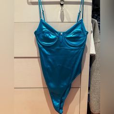 Perfect Condition - Never Worn Price Open To Negotiation Blue Underwire Bodysuit For Summer, Blue Underwire Bodysuit With Lined Body, Blue Fitted Bodysuit For Party, Fitted Blue Bodysuit For Party, Blue Fitted Party Bodysuit, Fitted Blue Party Bodysuit, Blue Fitted Lined Bodysuit, Blue Lined One-piece Bodysuit, Fitted Blue Bodysuit With Lined Body