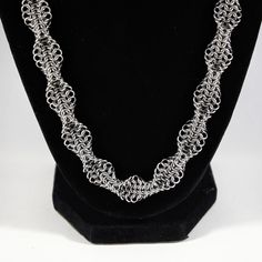 A chainmaille necklace using a mesmerizing geometric twist on the traditional european 4-in-1 weave. * Won't tarnish or change color over time * Can be cleaned with warm soapy water * Made with 20 gauge stainless steel jump rings and an 11mm stainless steel clasp Pop Can Art, Chainmaille Jewelry Patterns, Chainmaille Necklace, Chainmail Necklace, Chainmail Jewelry, Chain Maille Jewelry, Handmade Wire Jewelry, Chain Mail, Chain Jewelry