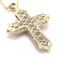 The Zeke Pendant A bold expression of faith, this amazing cross is a treasured symbol. Fashioned with lab grown diamonds totaling 6.00 carat, with a color ranking of I-J and a clarity of VS-SI. This 3 dimensional religious symbol is created in 14K yellow gold and is suspended on a rope chain with a lobster clasp. This item is Sku number 454801 An IGL certificate can be requested, please allow the Lab time for certifying, a possible 2 weeks for shipping. We will ship sooner when possible. If you Iced Out Diamond Cross Jewelry, Diamond White Cross-shaped Diamond Jewelry, Diamond Cross Jewelry With Diamond Accents, Cross Shaped Diamond Jewelry With Accents, Iced Out Diamond Cross Pendant Jewelry, Luxury Cubic Zirconia Cross Jewelry, Diamond White Cross Jewelry With Pave Setting, Luxury Cross-shaped Diamond Jewelry, Iced Out Diamond White Cross Jewelry