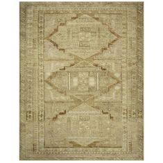 an antique rug with beige and brown colors