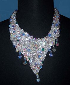 "A stunningly unique crystal necklace. Swarovski  clear crystal beads and clear seed glass beads with an odd blue crystal bead dotted here and there. Sewn onto felt and backed with silver leather. Neck opening 12cm(5\"), inner length 40cm (15½\"), total length 26cm (10\"). This sparkling necklace speaks for itself, even at the Oscar ceremonies it would catch everybody's eye.  Gently taken care of it will last a lifetime." Silver Glass Crystal Necklaces For Parties, Silver Crystal Necklace For Party, Silver Glass Crystal Necklace For Party, Clear Beaded Jewelry For Party, Unique Crystal Jewelry With Rhinestones, Clear Beaded Party Jewelry, Party Beaded Clear Jewelry, Silver Crystal Beaded Necklaces With Rhinestones, Silver Glass Beaded Necklaces For Party