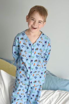 "Comfort is the main goal with this adorable pajama top pattern! This collarless button up PJ top pattern can be made in a large variety of woven fabrics and offers two sleeve lengths. Vick and Vicky's Button Up PJ Top is perfect for any season! You're little ones will love snuggling up in this one!  If you are looking for the full PJ Set please see my pajama set bundle. Pattern comes with a full tutorial and color photos in an easy to print PDF. Tutorial includes body measurements chart, fabric Patterned Printed Long Sleeve Sleepwear, Casual Long Sleeve Patterned Sleepwear, Casual V-neck Tops For Pajama Party, Cotton Buttoned Sleepwear For Pajama Party, Cotton Sleepwear With Buttons For Pajama Party, Playful Long Sleeve Sleep Top, Long Sleeve Buttoned Sleepwear For Pajama Party, Relaxed Fit Long Sleeve Sleepwear With Buttons, Button-up Sleepwear For Pajama Party