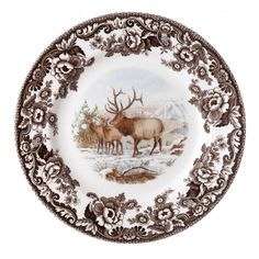 a brown and white plate with an elk scene on it