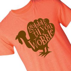 Don't be a turkey! Wear cool graphic tees like this when digging into a family feast! Printed with a turkey design and text that reads "Gobble Till You Wobble", this fall t-shirt makes a stylish statement come Thanksgiving. You could even stock up and pass out to the whole family. Coordinating family pics? How cute! Pro tip: order a size up from normal so there's more room to have second or third helpings of pie! © OTC

o Fits chest sizes 34-36
o Brand: Gildan®
o Short sleeve
o Preshrunk 100% ri Thankful Shirt Ideas, Thanksgiving Vinyl Shirts, Thanksgiving T Shirt Ideas, Kids Thanksgiving Shirts, Thanksgiving Shirt Ideas, Thanksgiving Tshirt Ideas, Homemade Shirts, Funny Thanksgiving Shirts, Turkey Trot