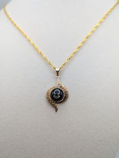 10k Gold Black Star Natural Sapphire Pendant Necklace This beautiful necklace will make a meaningful present.  Condition: Minimal signs of wear to its age Pendant properly 10k verified  Pendant: 10K Gold 32.5 mm Height 16.3 mm Width Length of chain: 18 inch 18k GF Gemstone:  Large Sapphire 9.6mm x 9.3 mm All our jewelry is properly washed and disinfected to ensure customers get clean items with every order. Comes in a beautiful gift box. Fine Jewelry Cabochon Necklaces For Anniversary, Anniversary Fine Jewelry Necklace With Cabochon, Anniversary Fine Jewelry Cabochon Necklace, Anniversary Cabochon Fine Jewelry Necklace, Black 14k Stamped Jewelry As Gift, Black 14k Stamped Jewelry For Gift, Yellow Gold Cabochon Necklace For Anniversary, Anniversary Yellow Gold Cabochon Necklace, Elegant 14k Stamped Necklace For Memorial