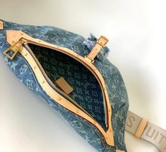 Introducing our highly-anticipated denim monogram bum bag, now available for pre-order! Make a fashion statement while keeping your belongings organized and secure. This durable and stylish bag is the perfect accessory for any outfit. Reserve yours now and be the envy of all your friends! Soft denim material 14 in X 6.3 in X 3in Adjustable strap Gold Hardware Comes with Dust Bag *FINAL SALE NO RETURNS! Since our bags are custom made you may experience a slight glue scent, do not be alarmed, it j Denim Material, Girls Boutique, Bum Bag, Bag Bag, Stylish Bag, You Bag, Gold Hardware, Fashion Statement, Pre Order